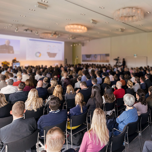 Keynote by Chris Rusche at the BSI Customer Summit 2024 – a large audience attending the presentation on the latest updates in the BSI Customer Suite.